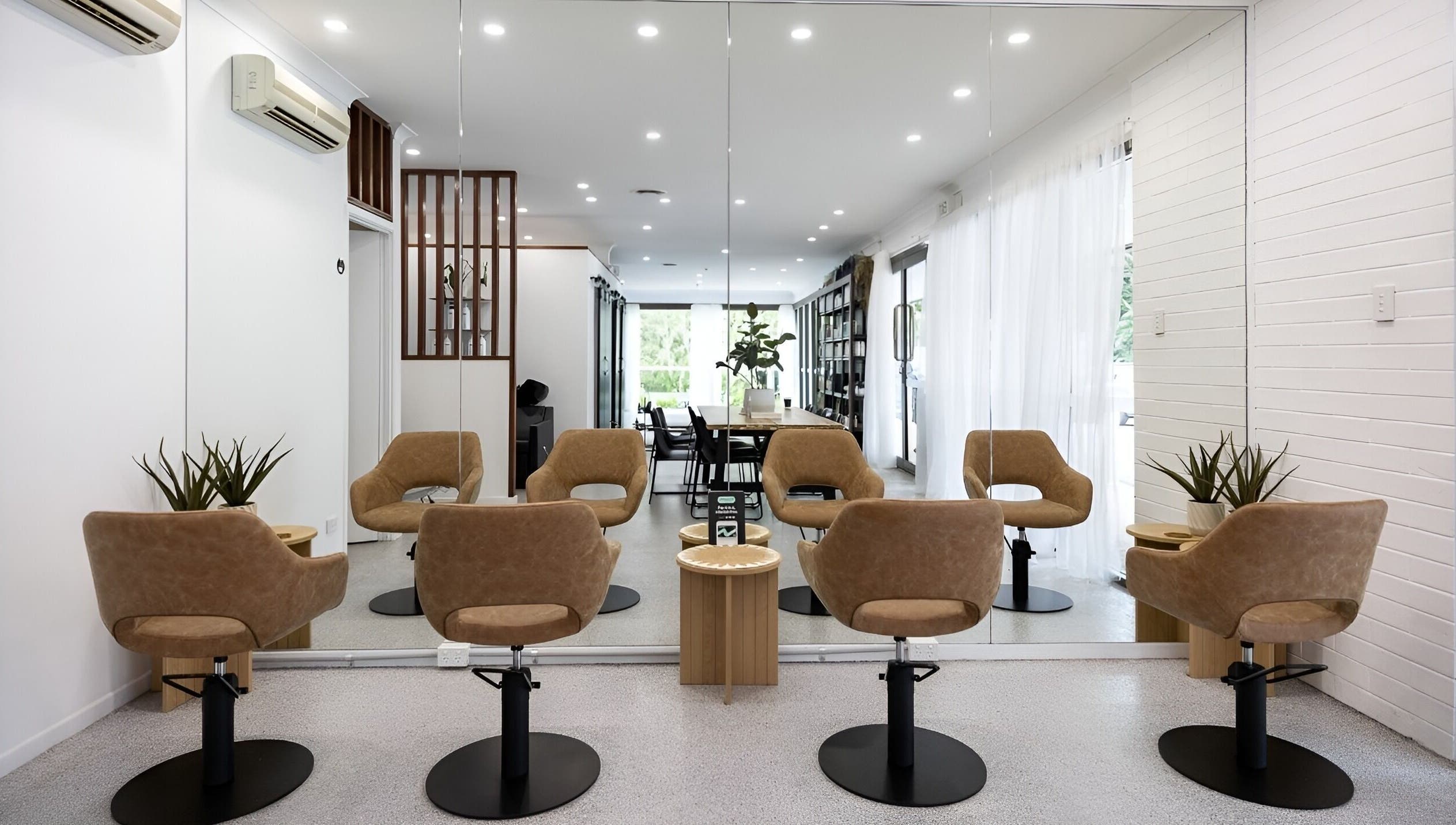 Edge Hairdressing salon interior with stylish chairs and mirrors, located in Tamborine Mountain, QLD, AU.