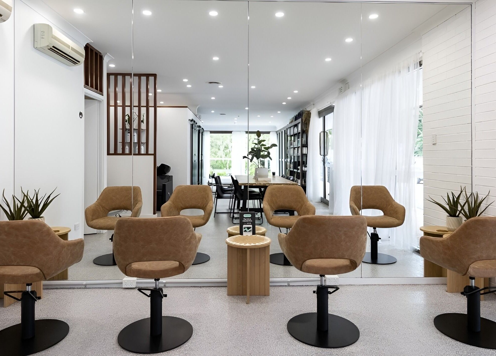 Edge Hairdressing salon interior with stylish chairs and mirrors, located in Tamborine Mountain, QLD, AU.