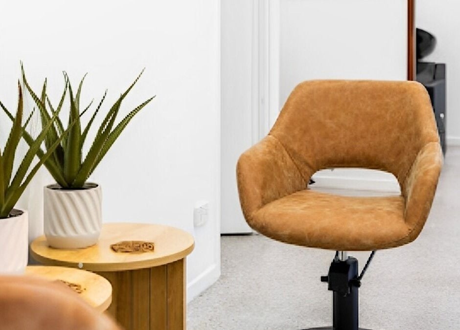 Stylish salon chair and potted plants at Edge Hairdressing, Tamborine Mountain, QLD, AU.
