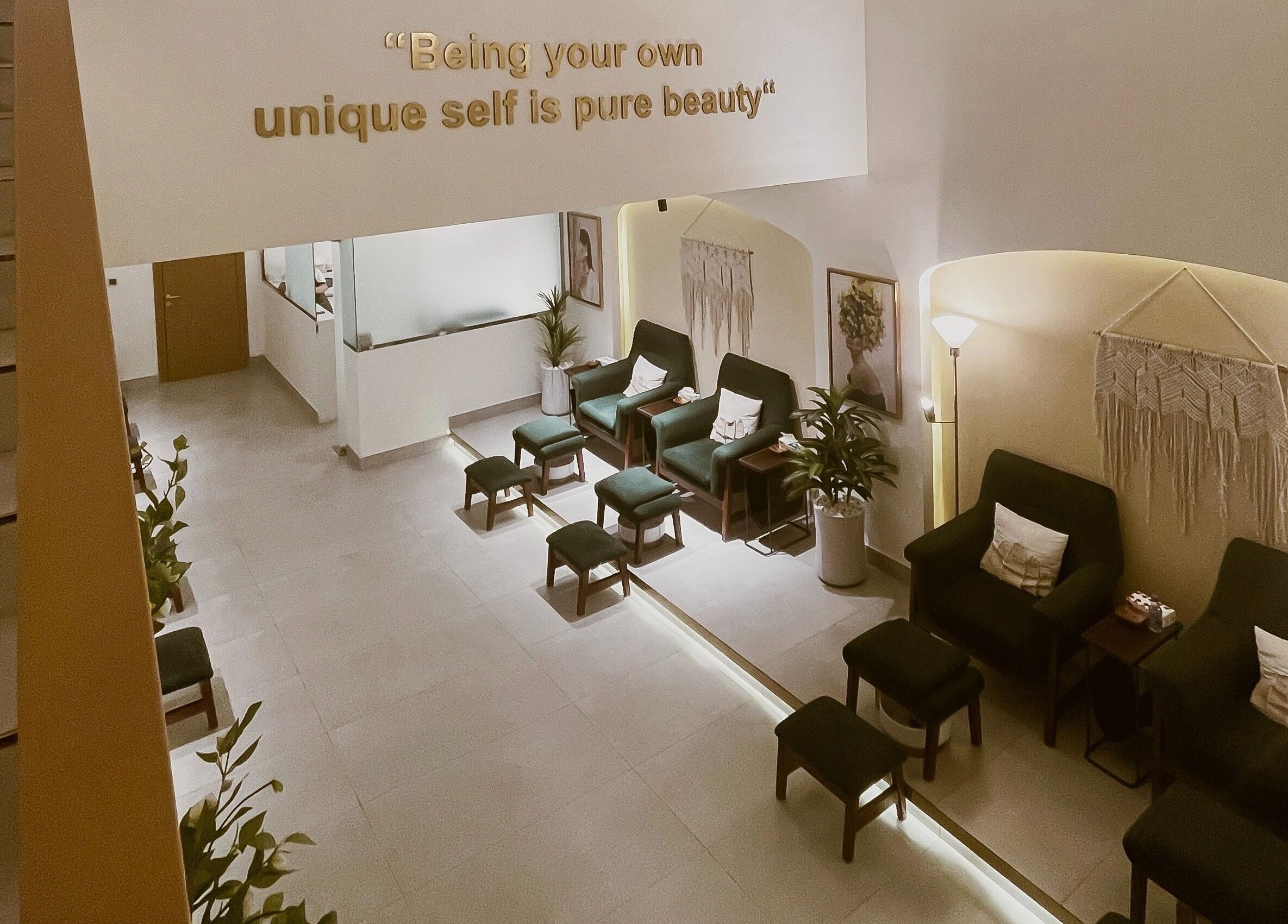 Inviting lounge at The Unique White Salon, Riyadh, Riyadh Province, SA with plush seating and elegant decor.