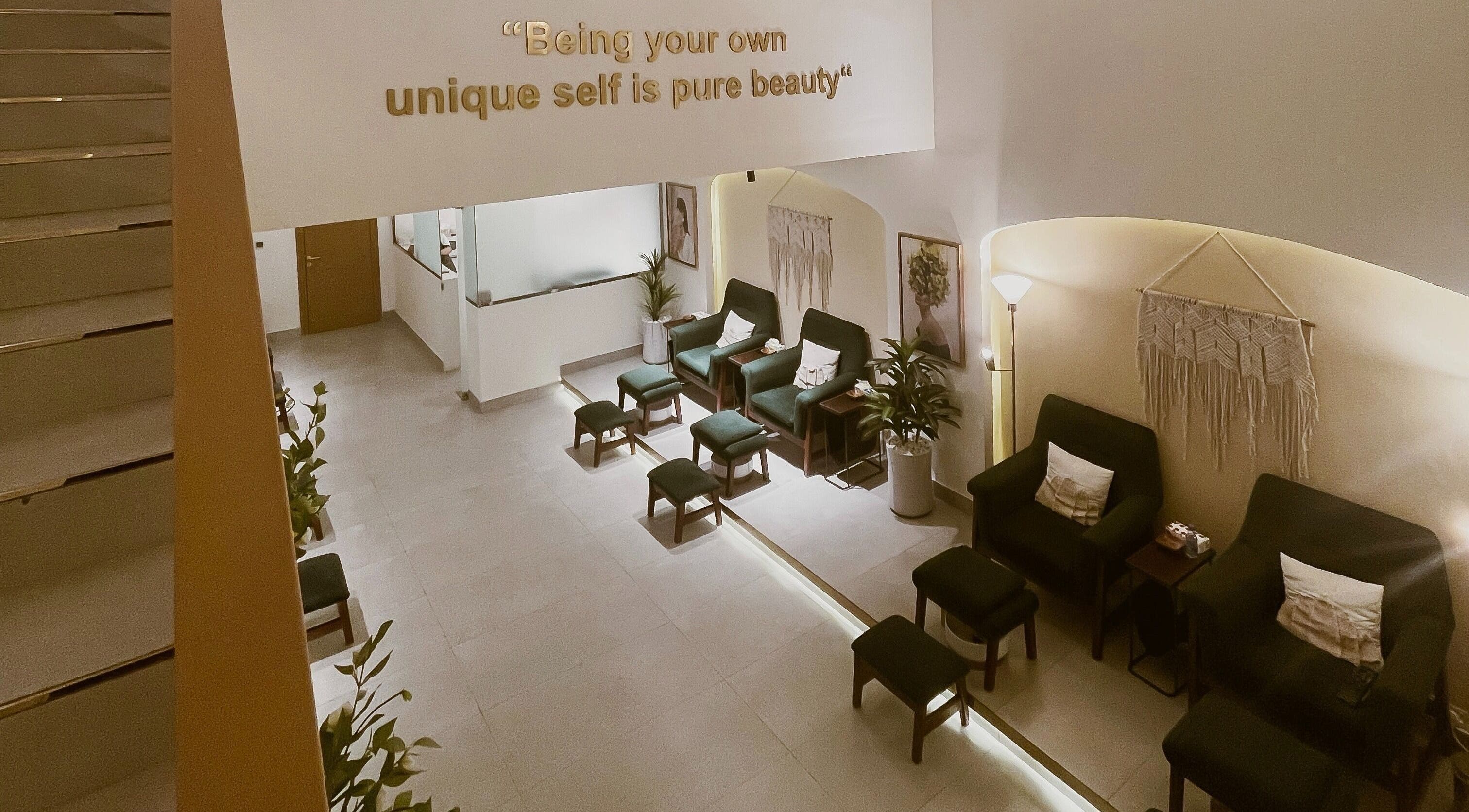 Inviting lounge at The Unique White Salon, Riyadh, Riyadh Province, SA with plush seating and elegant decor.