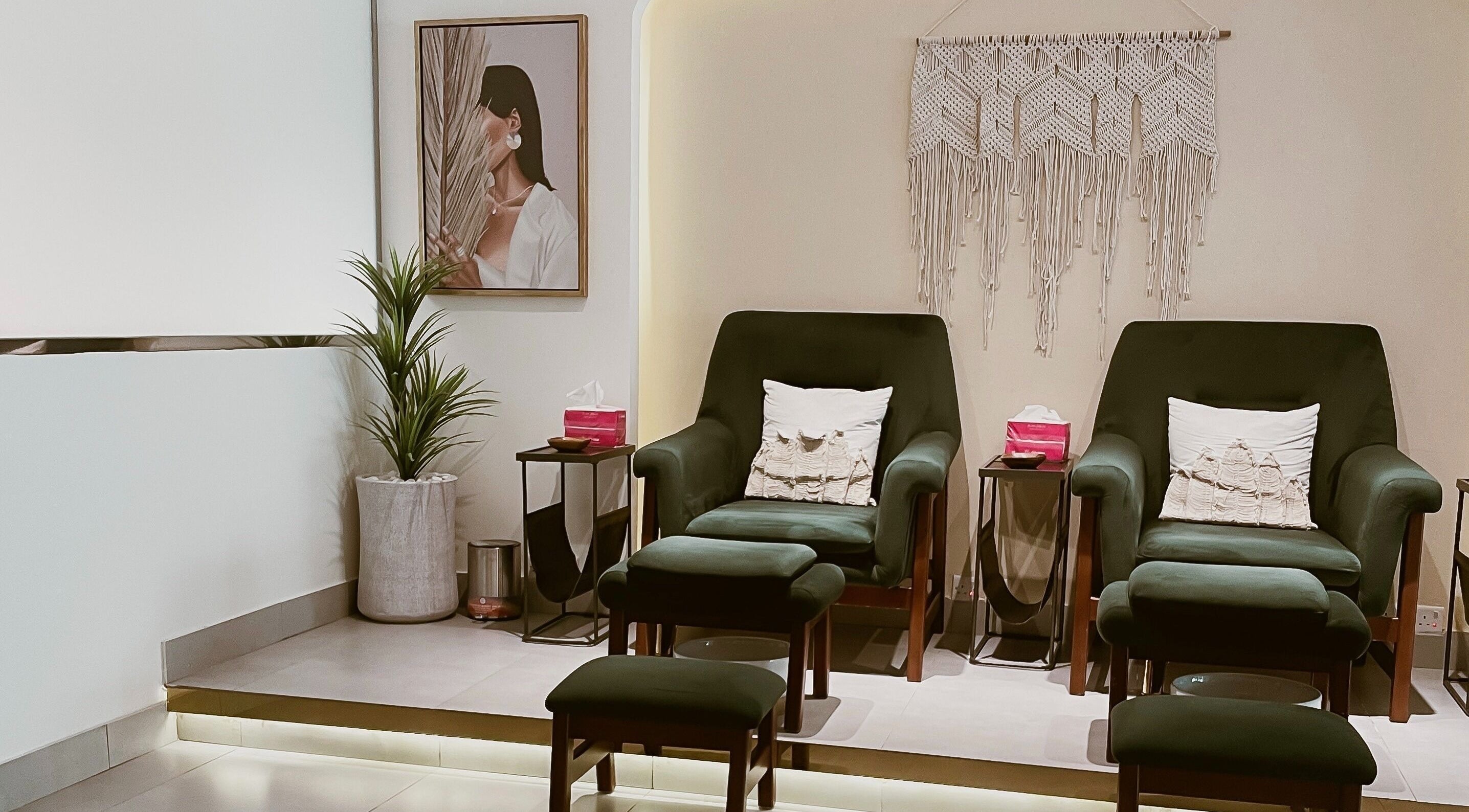 Relaxing lounge setup at The Unique White Salon, Riyadh, Riyadh Province, SA, with elegant armchairs and decor.