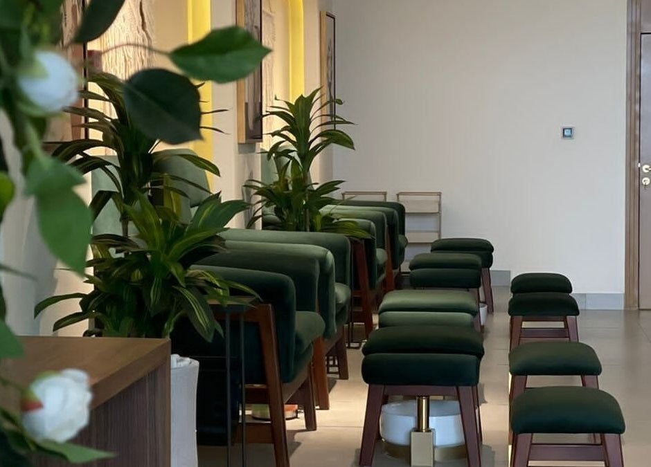 Elegant seating at The Unique White Salon, Riyadh, Riyadh Province, SA, with lush green plants.