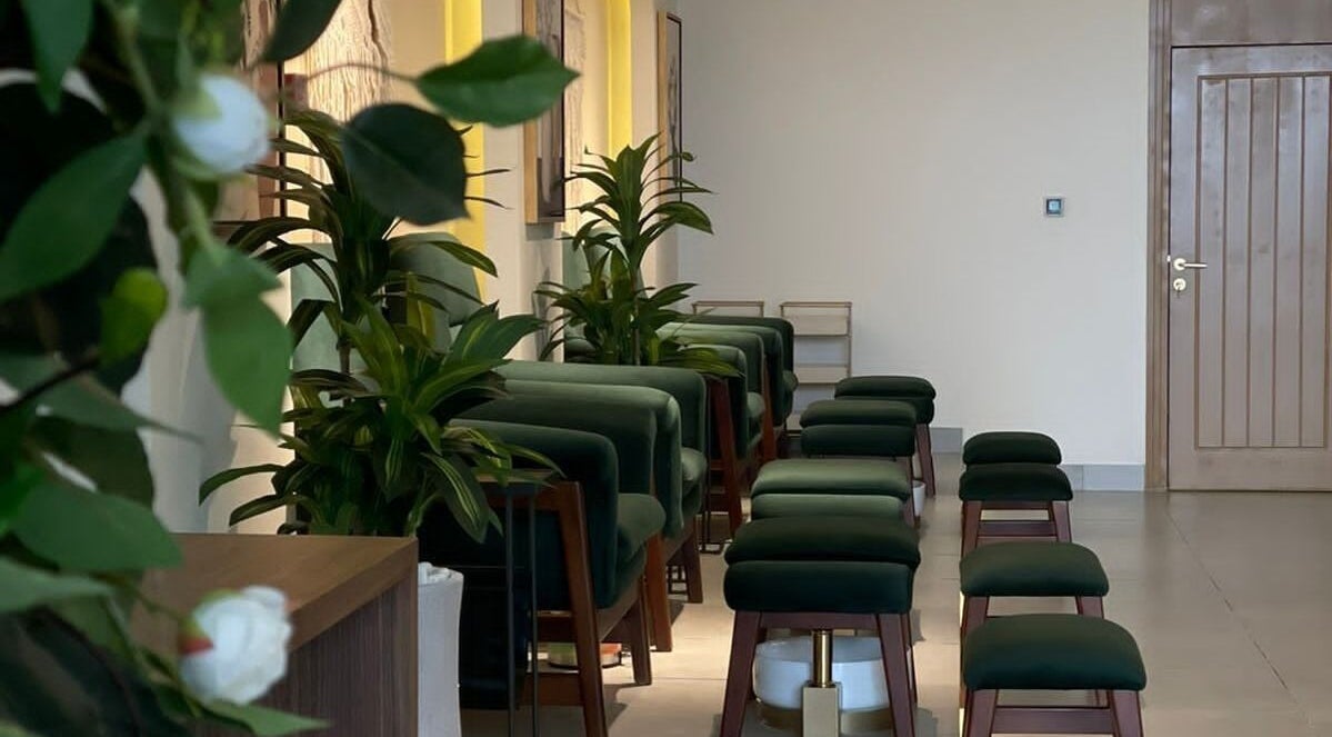 Elegant seating at The Unique White Salon, Riyadh, Riyadh Province, SA, with lush green plants.