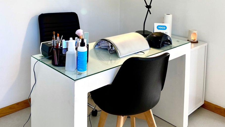 Modern nail station at Sculpted in Cape Town, Western Cape, ZA showcasing beauty essentials and lighting.