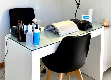 Modern nail station at Sculpted in Cape Town, Western Cape, ZA showcasing beauty essentials and lighting.