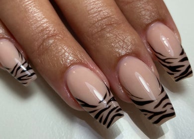 Stylish zebra print nails designed at Sculpted, Cape Town, Western Cape, ZA, showcasing modern nail artistry.