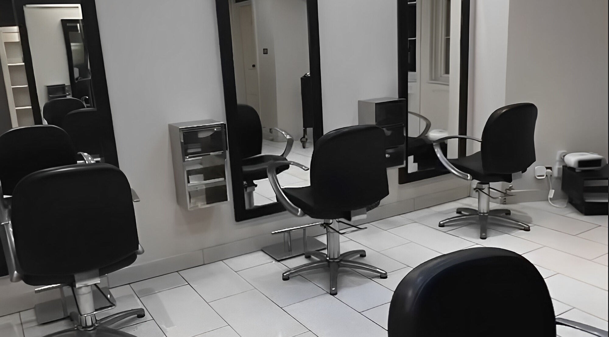 Modern salon chairs and mirrors at Betty’s Hair & Beauty, Ramsgate, England, GB.