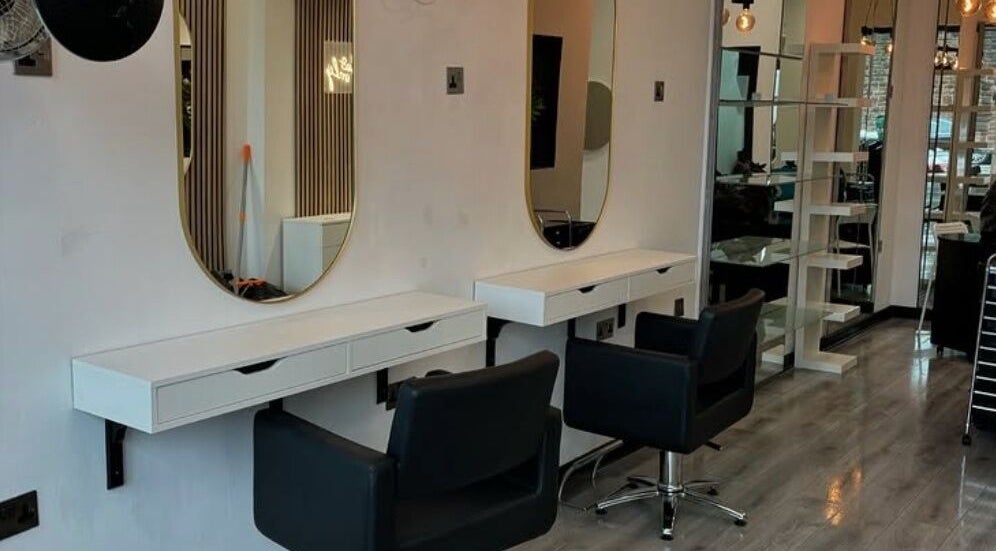 Modern salon interior with mirrors at Glow Bold & Beauty in Paisley, Scotland, GB.