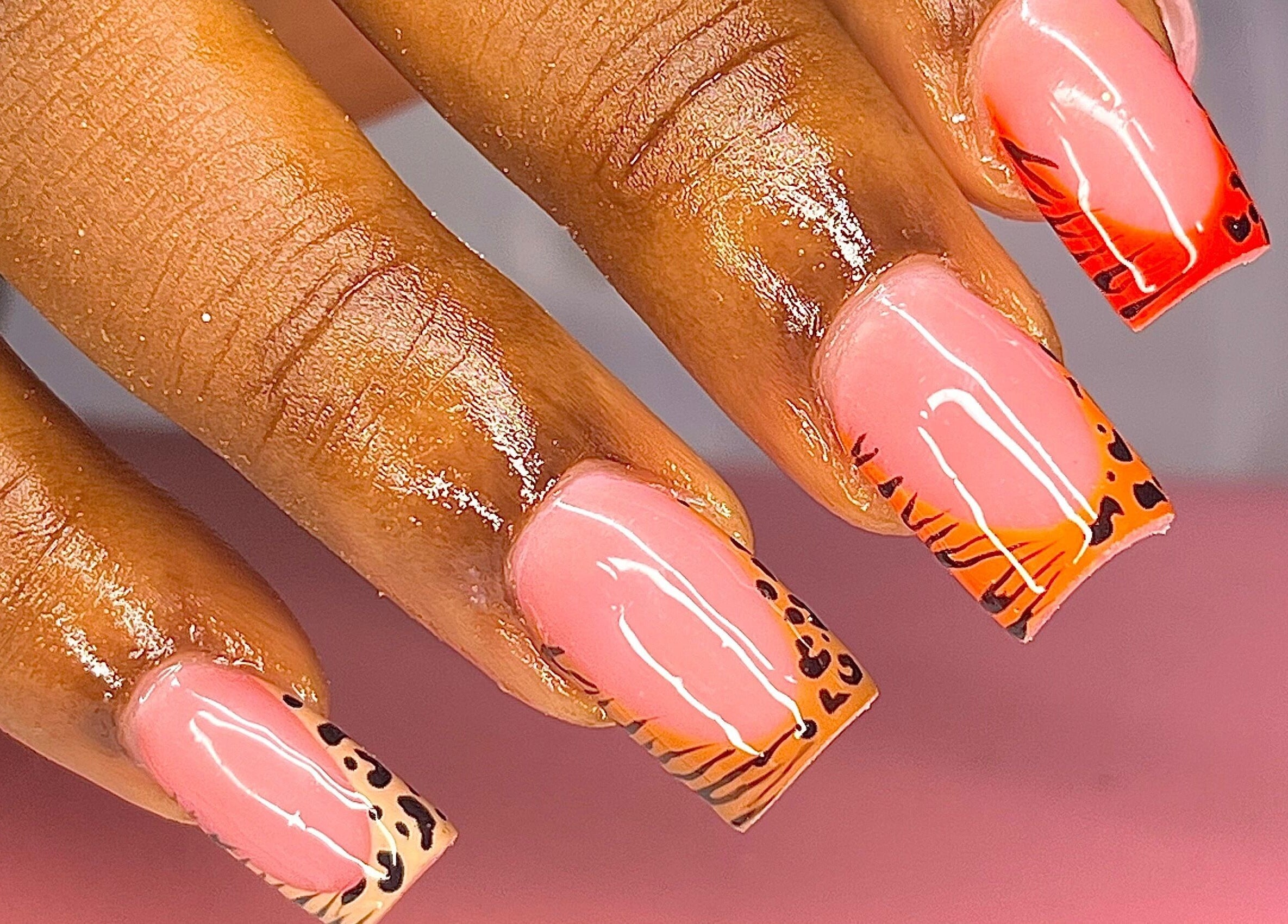 Bold tropical nail art at The Vanity Project, Mount Standfast, Saint James, BB, features vibrant colors and designs.