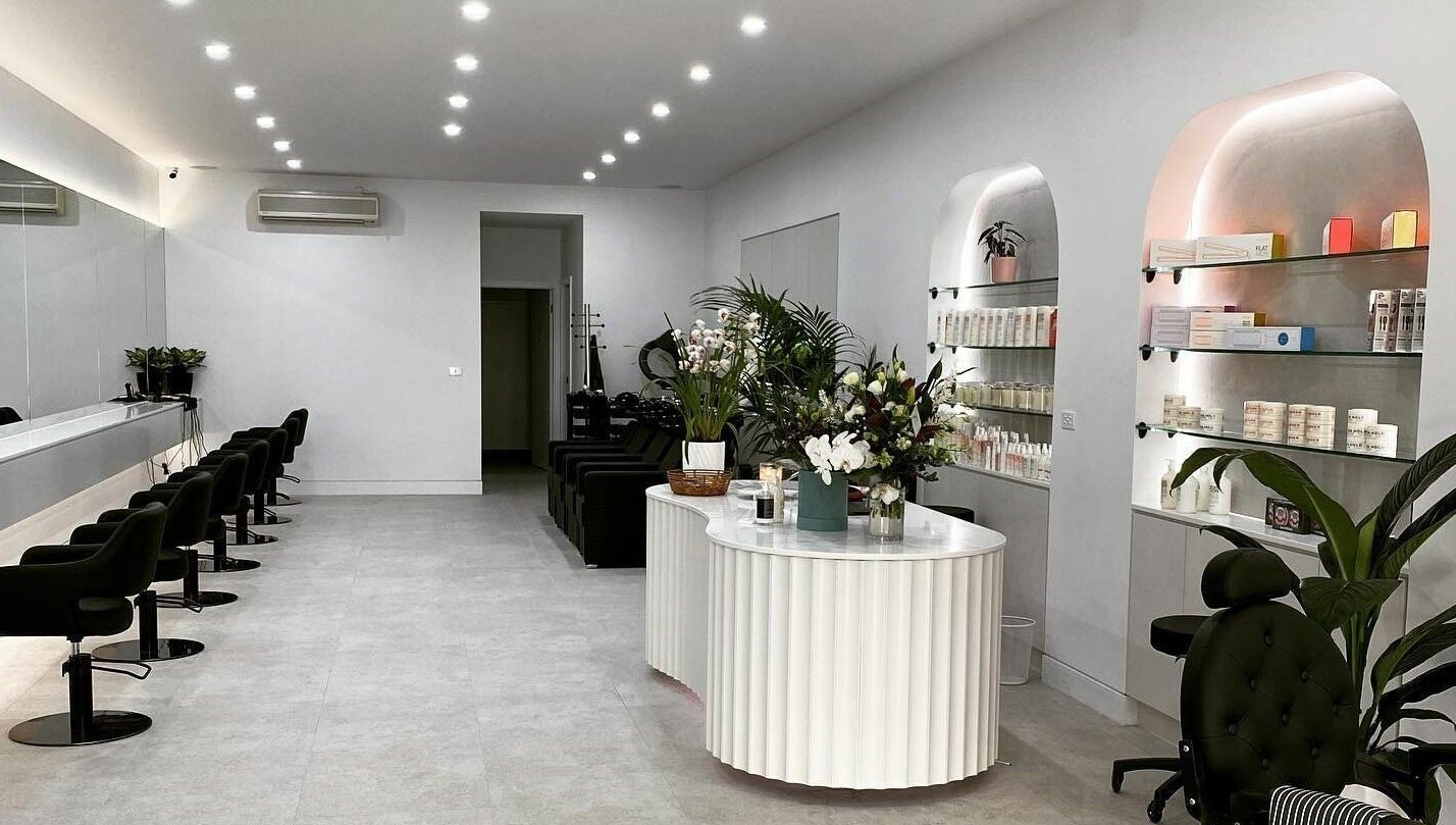 Spacious and stylish interior of Maliha Salon And Barber in Melbourne, Victoria, AU, featuring modern decor and amenities.