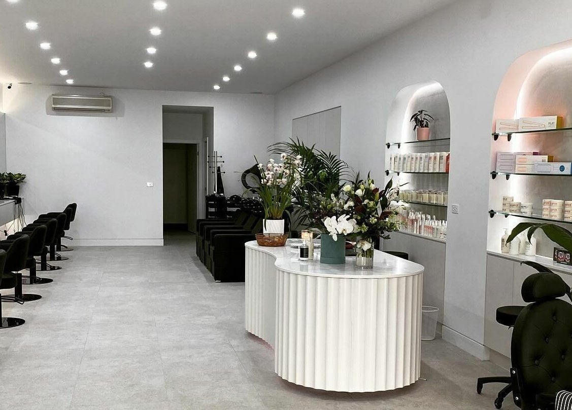 Spacious and stylish interior of Maliha Salon And Barber in Melbourne, Victoria, AU, featuring modern decor and amenities.