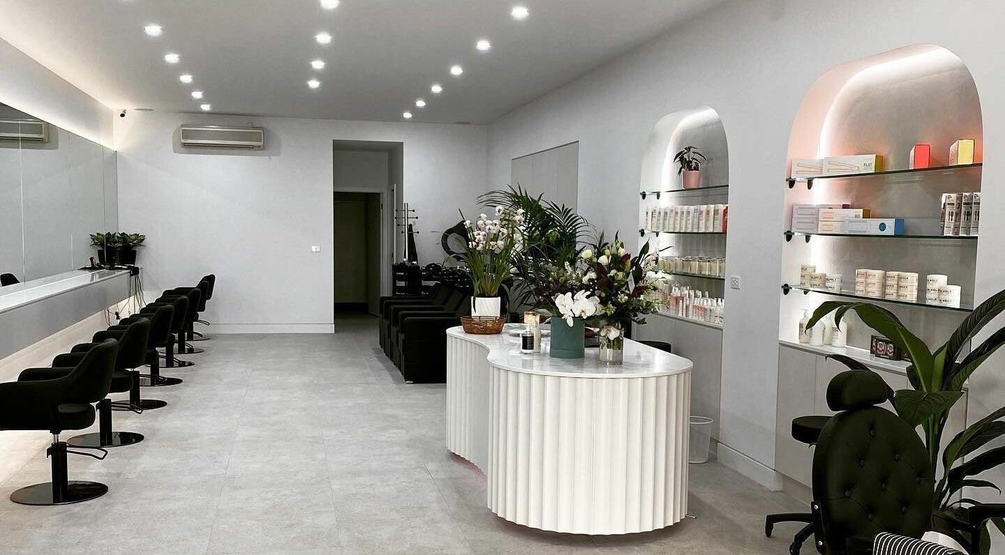 Spacious and stylish interior of Maliha Salon And Barber in Melbourne, Victoria, AU, featuring modern decor and amenities.