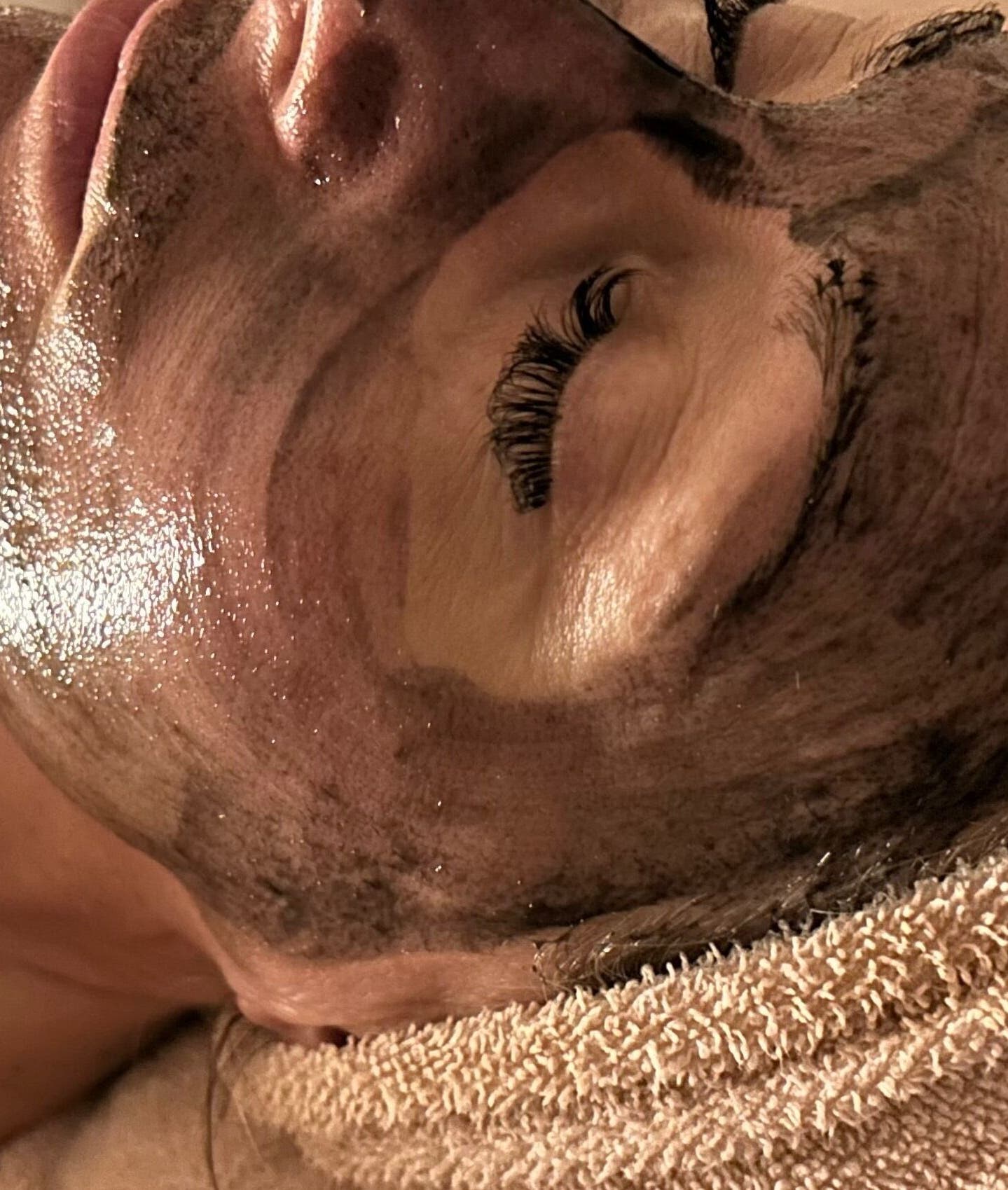 Facial treatment at Raven & Rose Aesthetics LLC in Stevens Point, Wisconsin, US, showcasing a relaxing mud mask.