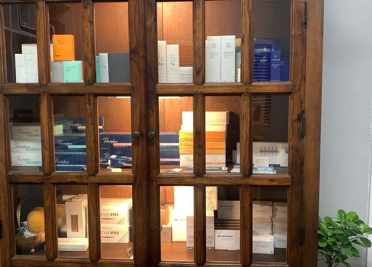 Beauty products elegantly showcased at Moi Moi Paarl, Paarl, Western Cape, ZA within a wooden cabinet.