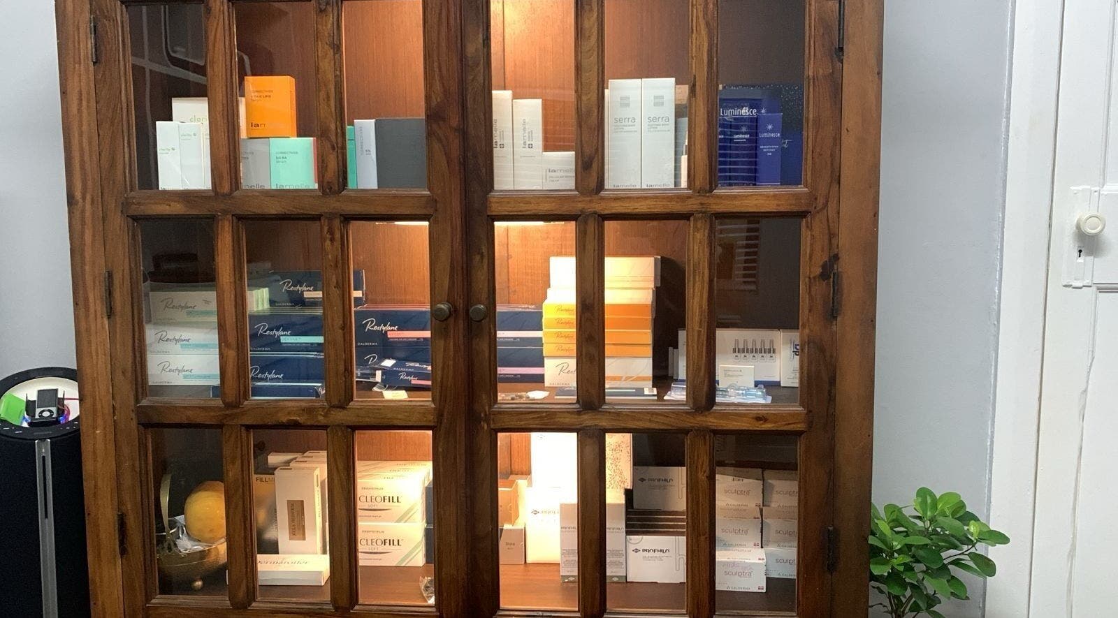 Beauty products elegantly showcased at Moi Moi Paarl, Paarl, Western Cape, ZA within a wooden cabinet.