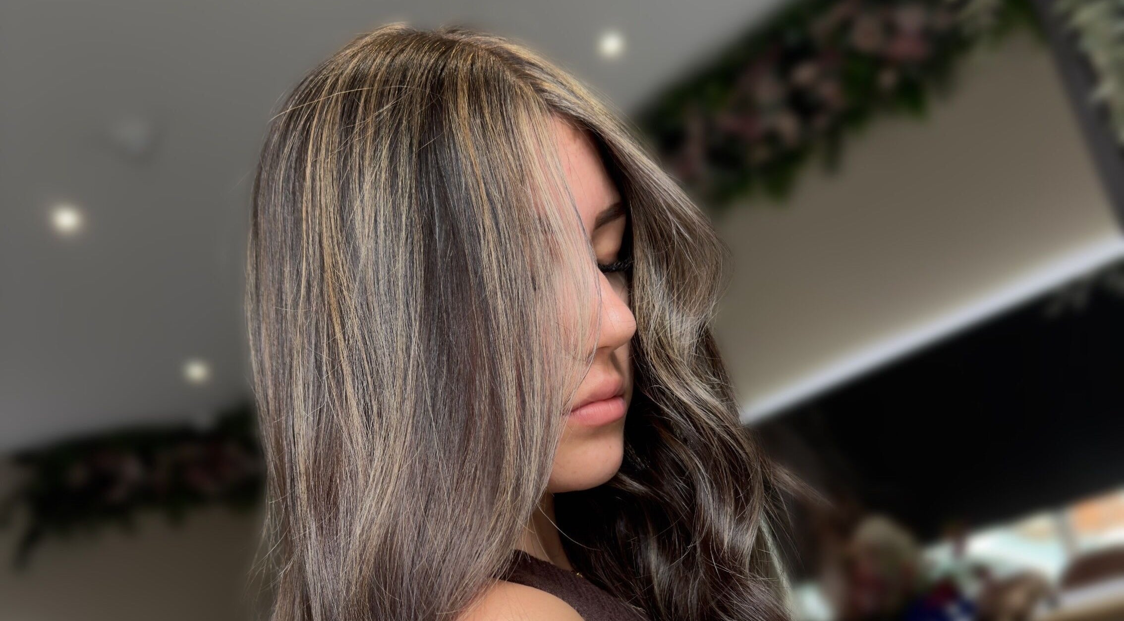 Woman with highlighted hair at Hair by Karmann, Rushden, England, GB.