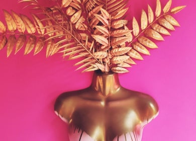 Artistic golden mannequin with leaf headdress at Shepack Beauty, Paignton, England, GB.