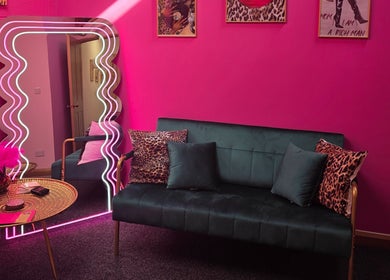 Stylish pink lounge at Shepack Beauty, Paignton, England, GB, featuring modern decor and chic accents.