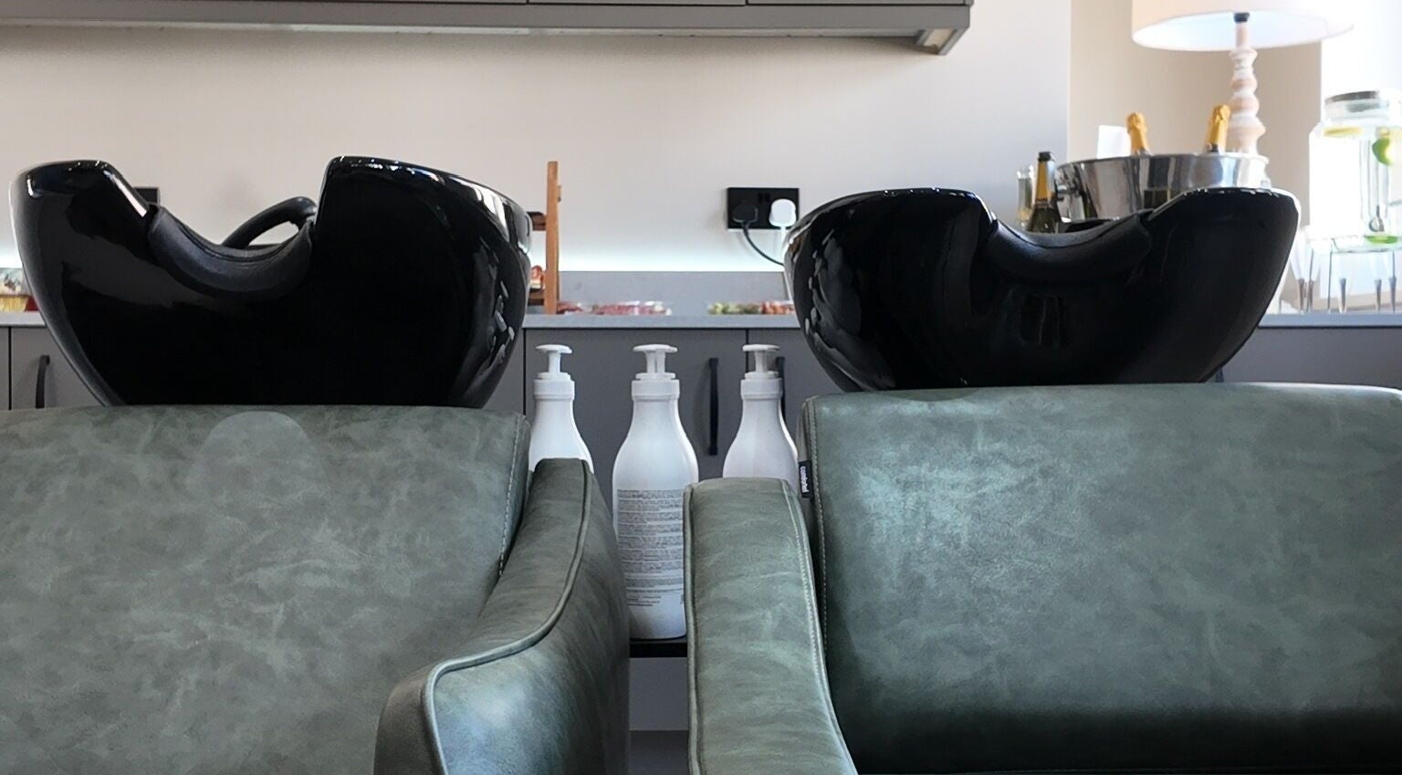 Modern wash basins and seating at Evolved Salon, Boroughbridge, England, GB. Experience luxury hair care.