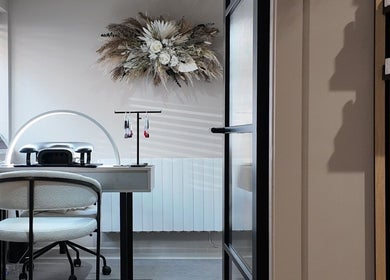 Cozy nail station at Evolved Salon, Boroughbridge, England, GB featuring elegant decor and professional tools.