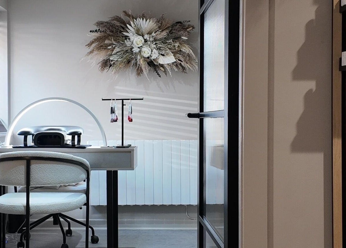 Cozy nail station at Evolved Salon, Boroughbridge, England, GB featuring elegant decor and professional tools.