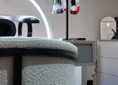 Modern chic interior of Evolved Salon, Boroughbridge, England, GB featuring stylish nail polish display.