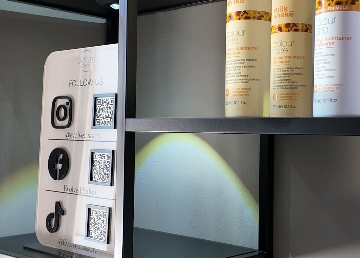 Evolved Salon's product display with social media info in Boroughbridge, England, GB.