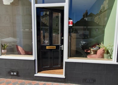 Entrance of CK Laser @ Salon Forty Four in Eastbourne, England, GB, featuring stylish window decor.