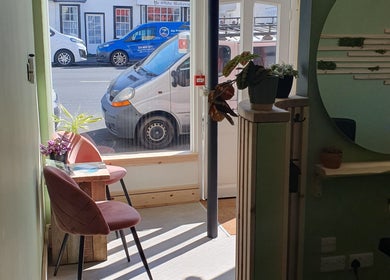 Inviting front nook setup with chairs and plants at CK Laser @ Salon Forty Four, Eastbourne, England, GB.