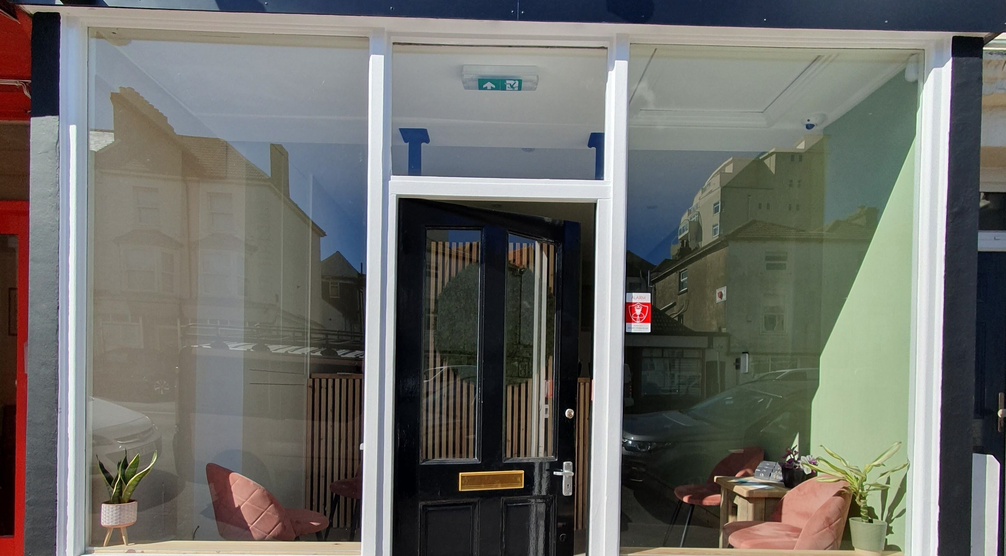 Front view of Salon Forty Four | Laser | Nails in Eastbourne, England, GB with modern glass facade.