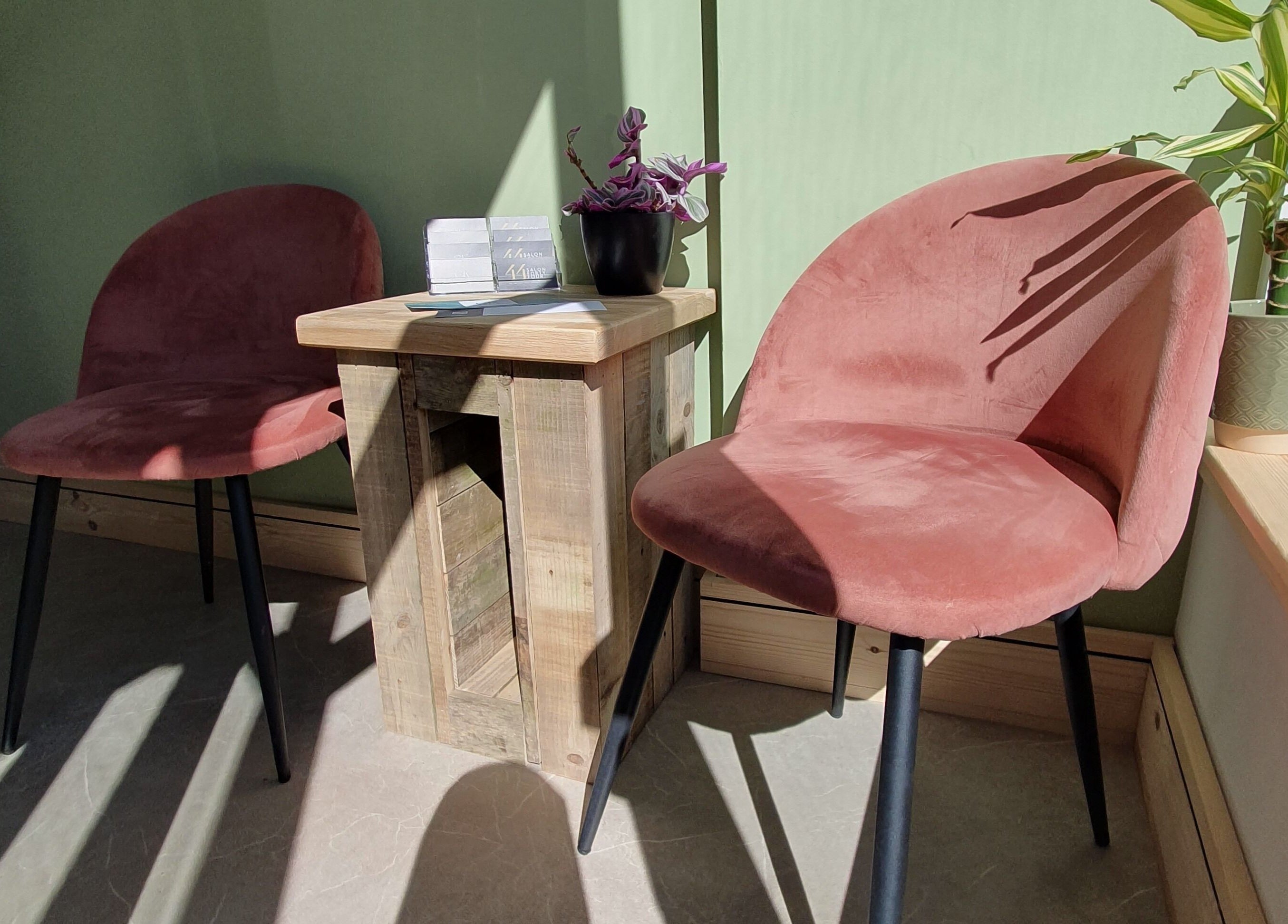 Salon Forty Four seating area with pink velvet chairs in Eastbourne, England, GB.