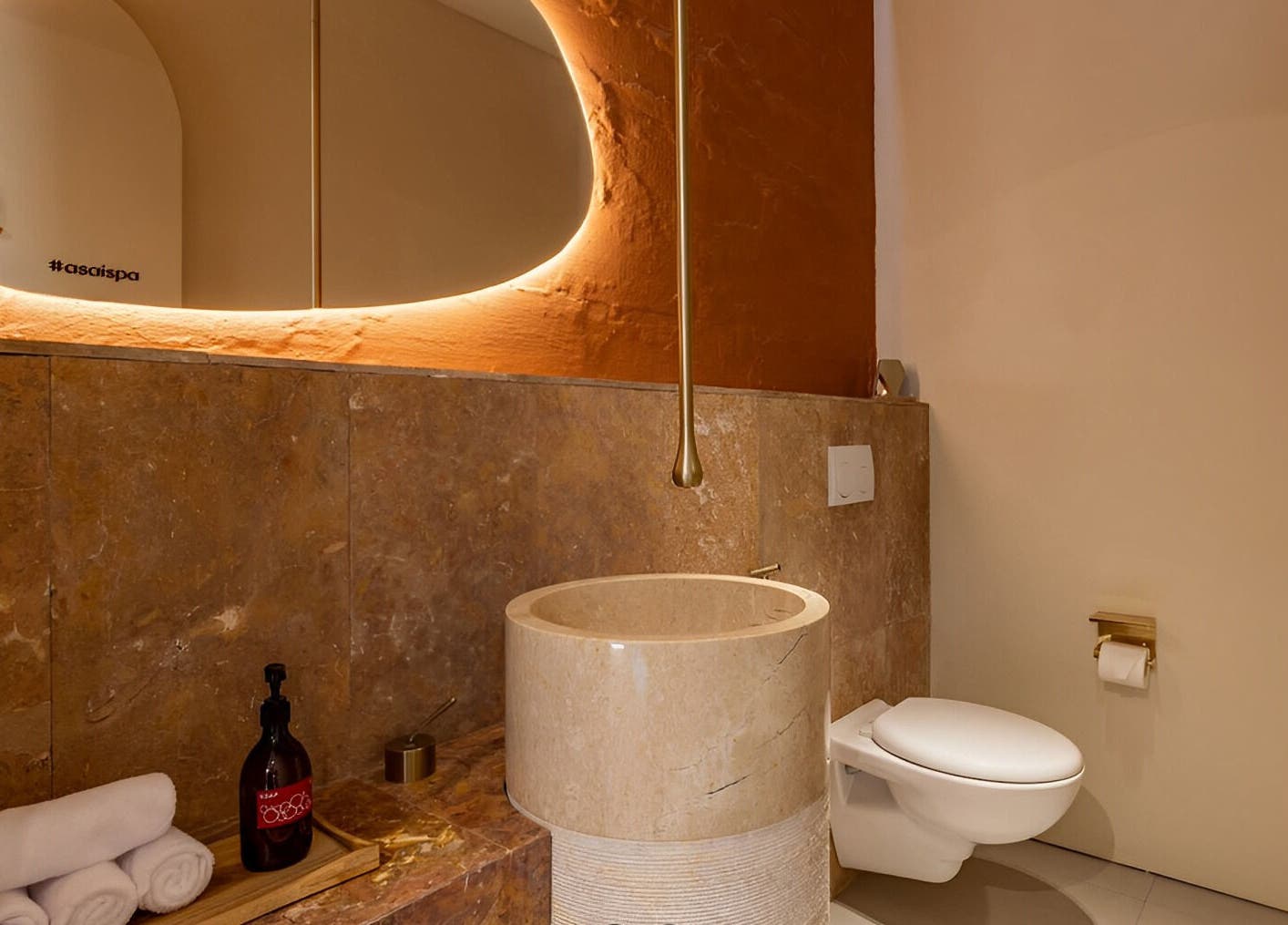 Luxurious washroom at Asai Spa, Bali, Bali, ID, featuring elegant marble and warm lighting.