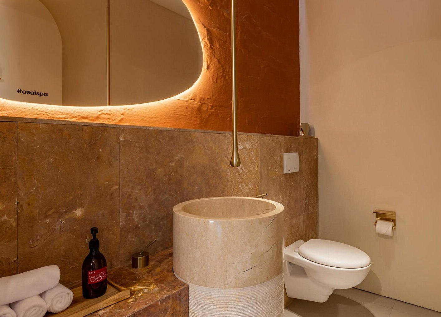 Luxurious washroom at Asai Spa, Bali, Bali, ID, featuring elegant marble and warm lighting.
