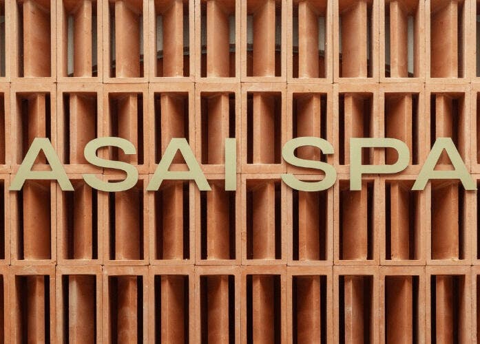 Elegant Asai Spa sign set against a warm, textured backdrop in Bali, Bali, ID.