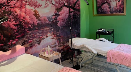 Serene massage room at Defined Elegance, Durban North, Kwazulu-natal, ZA, with cherry blossom mural.