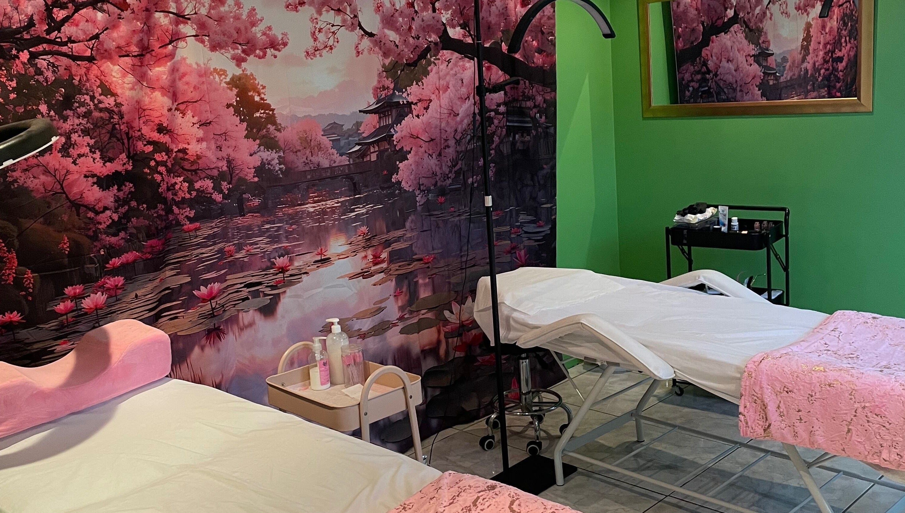 Defined Elegance massage room in Durban North, Kwazulu-natal, ZA with cherry blossom decor and treatment beds.