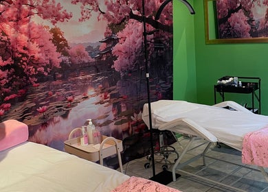 Defined Elegance massage room in Durban North, Kwazulu-natal, ZA with cherry blossom decor and treatment beds.