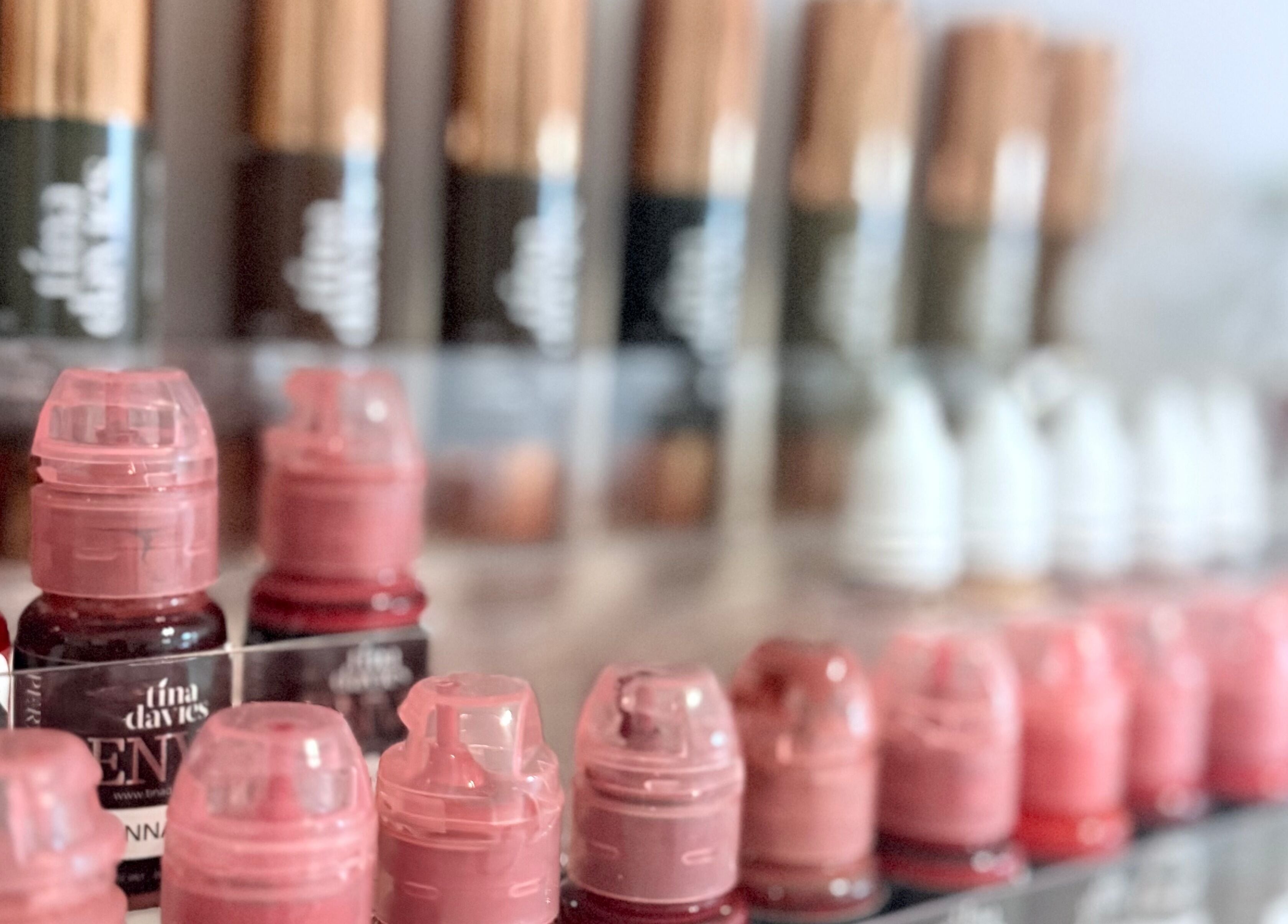 Vibrant pigment bottles at Ashley Blakemore Beauty & PMU, Cheadle, England, GB showcasing diverse colors.