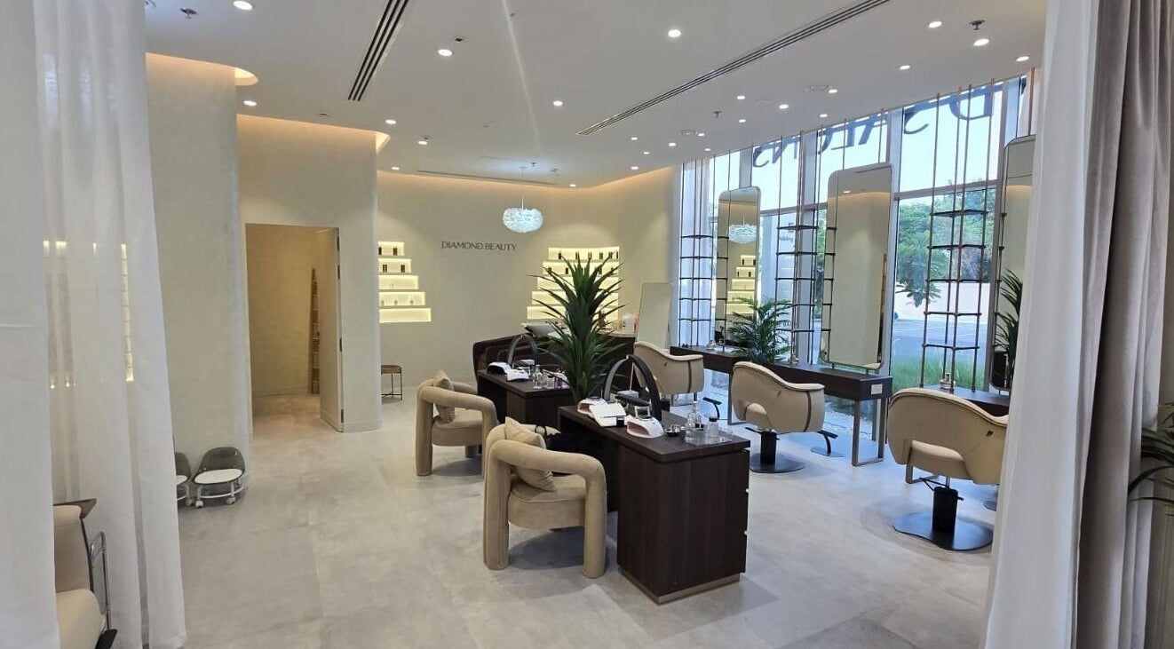 Interior of Diamond Salon Al Badia in Dubai, Dubai, AE, showcasing modern design with plush seating and decor.