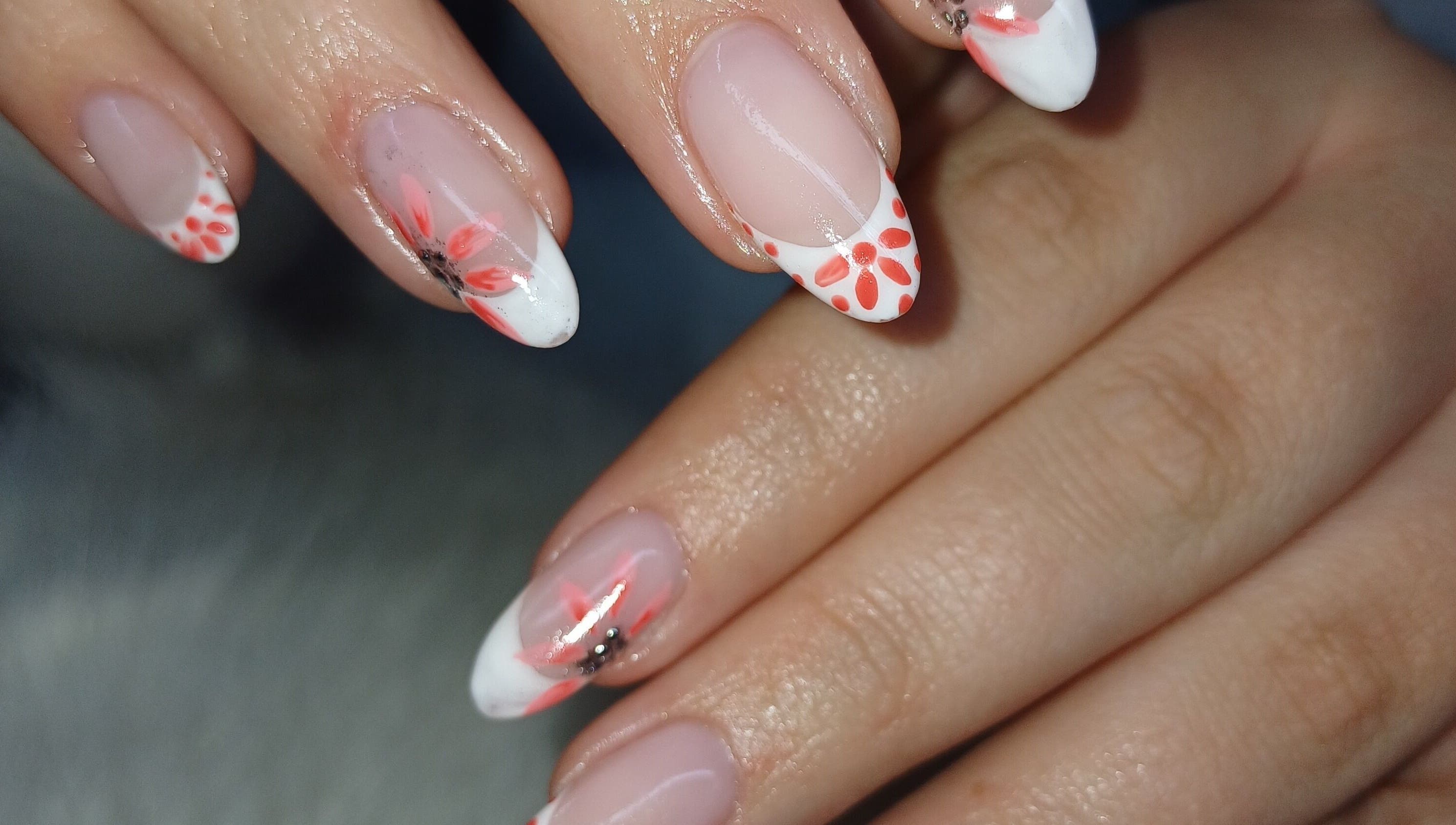 Floral nail art at Nails by Meegs, Edenvale, Gauteng, ZA. Features vibrant designs on neatly manicured fingers.