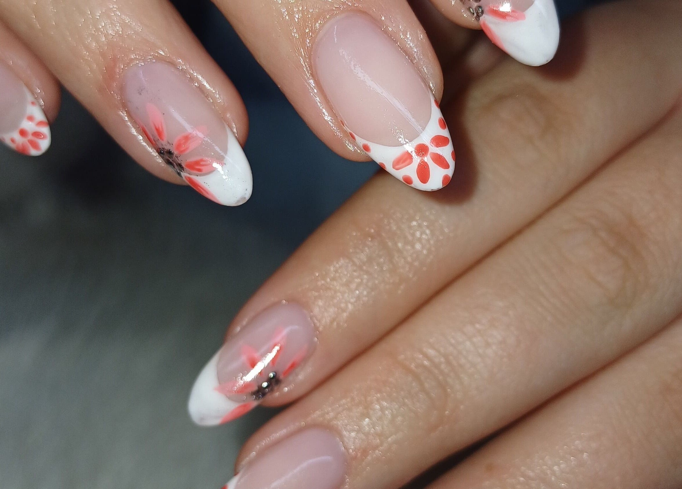 Floral nail art at Nails by Meegs, Edenvale, Gauteng, ZA. Features vibrant designs on neatly manicured fingers.