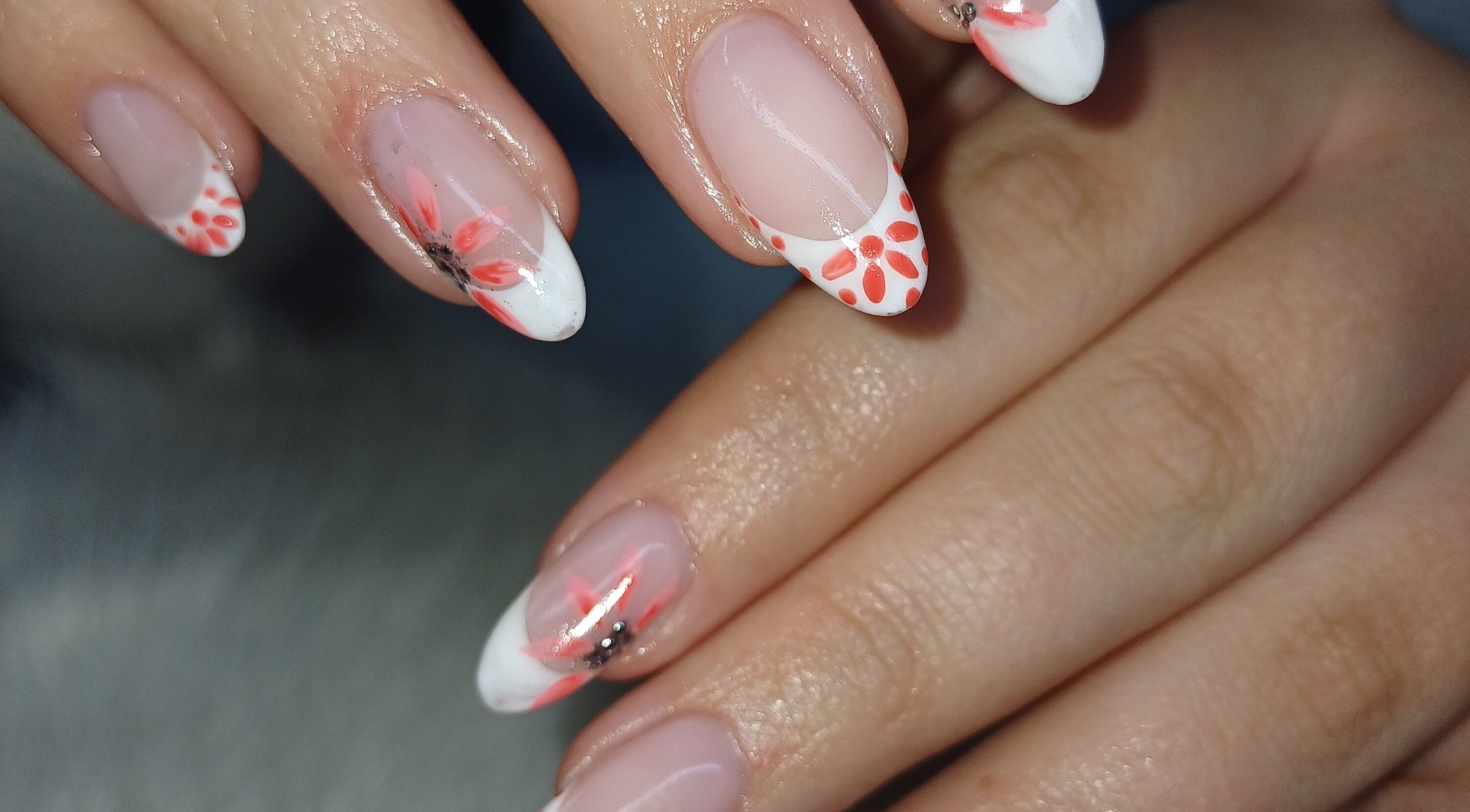 Floral nail art at Nails by Meegs, Edenvale, Gauteng, ZA. Features vibrant designs on neatly manicured fingers.