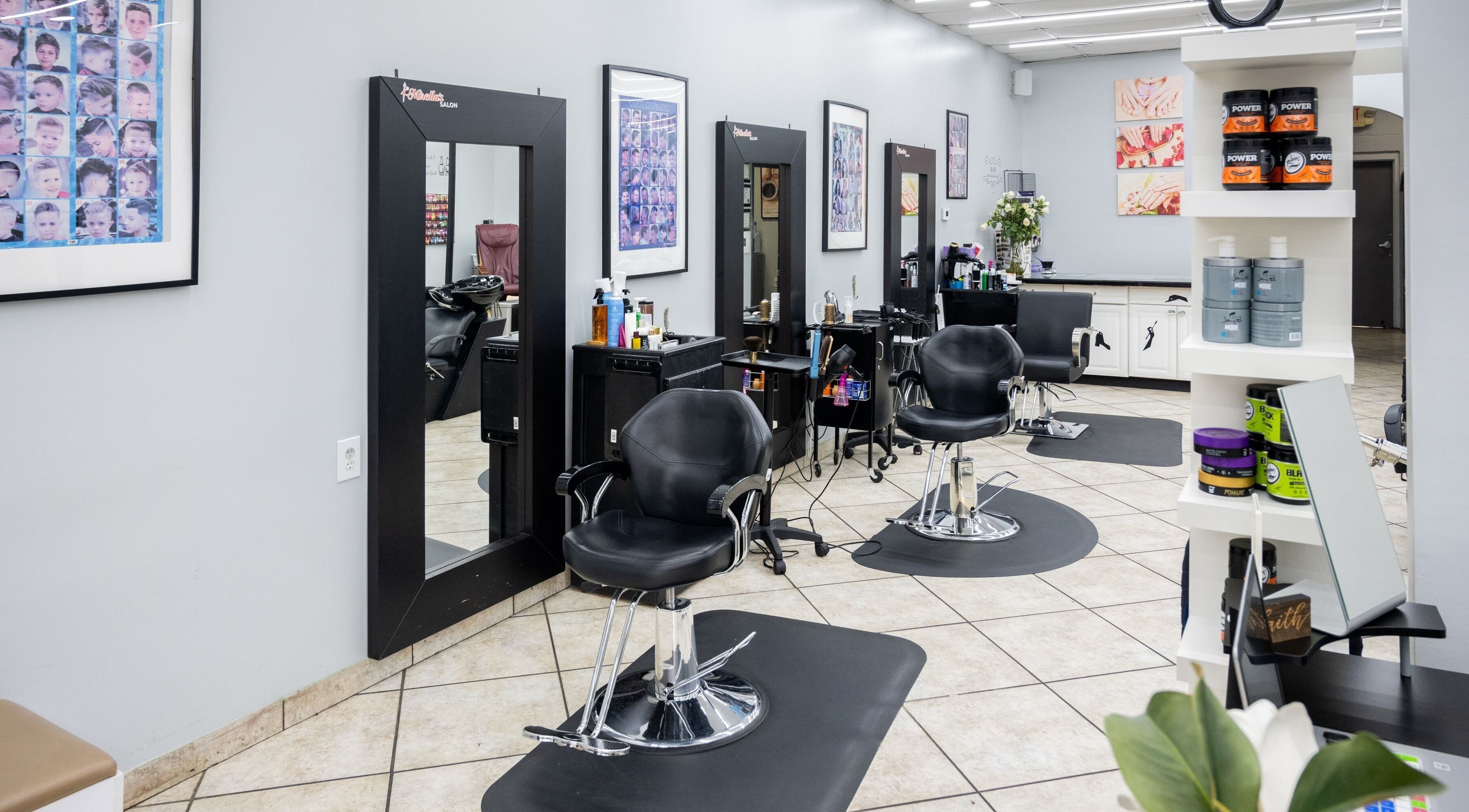 Modern interior of Mirella's Salon in Kennesaw, Georgia, US with stylish chairs and beauty products.