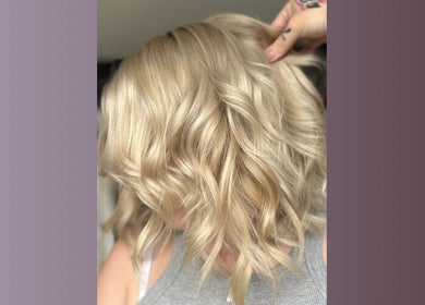 Stylish wavy blonde hairstyle at Five One Four, Littlehampton, England, GB.