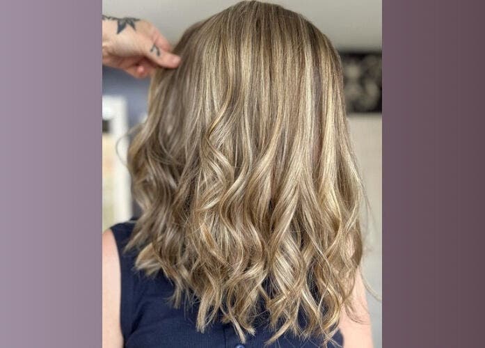 Elegant blonde curls at Five One Four in Littlehampton, England, GB showcase expert styling.