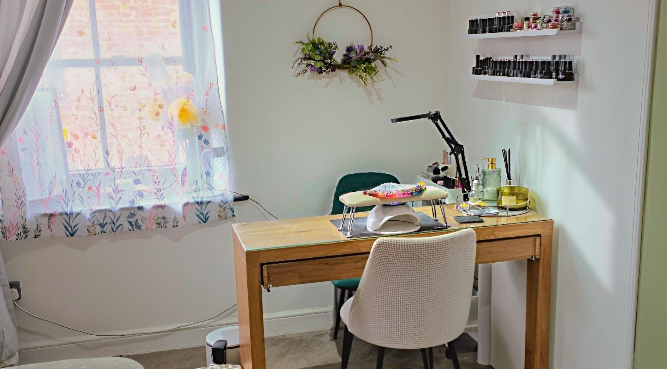 Cozy nail station at Beatrix Beauty, Belper, England, GB with natural light and floral decor.