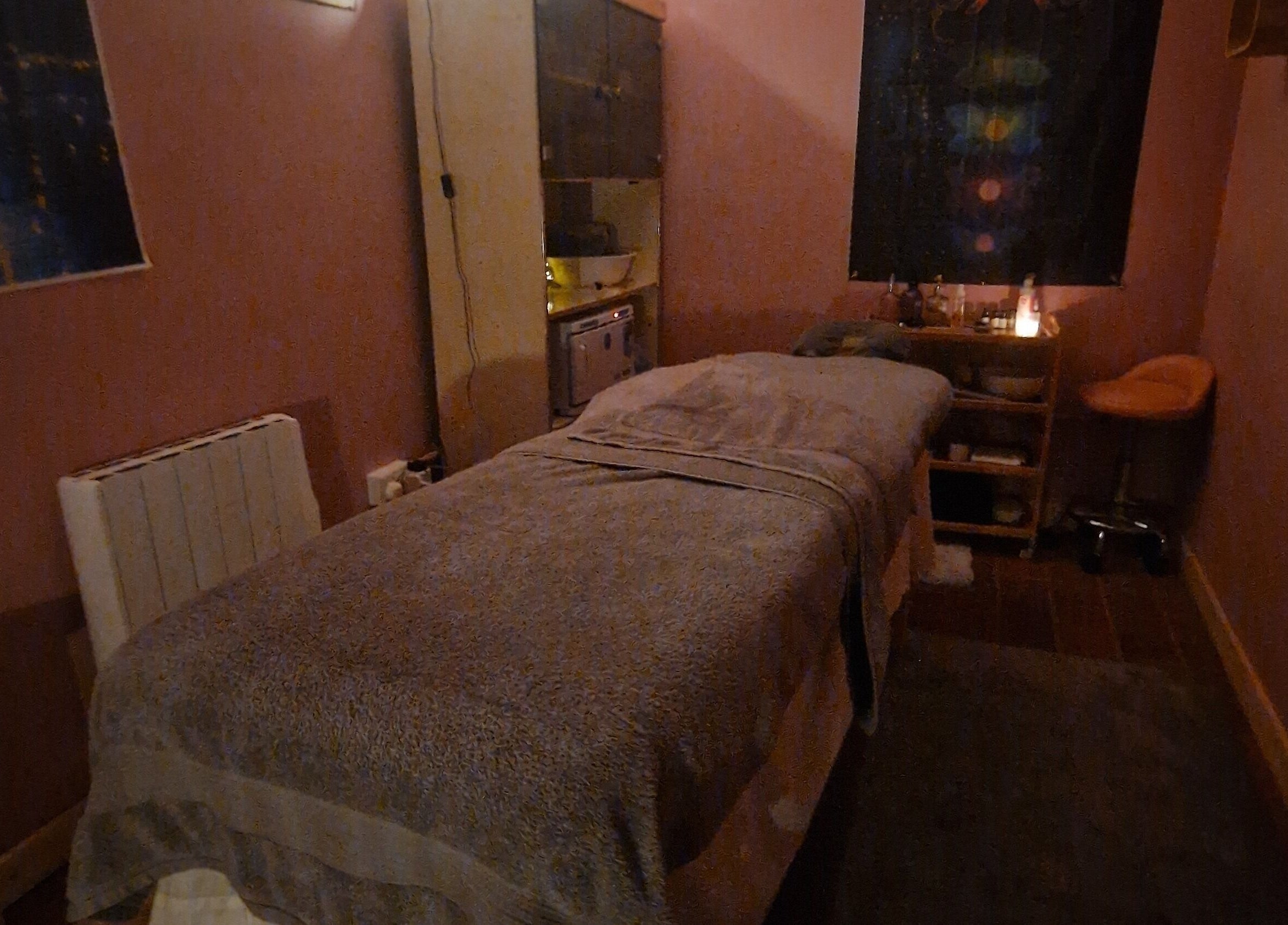 Tranquil room in The Green Witches Doneraile Well Being Hub, Doneraile, County Cork, IE, featuring a massage table.