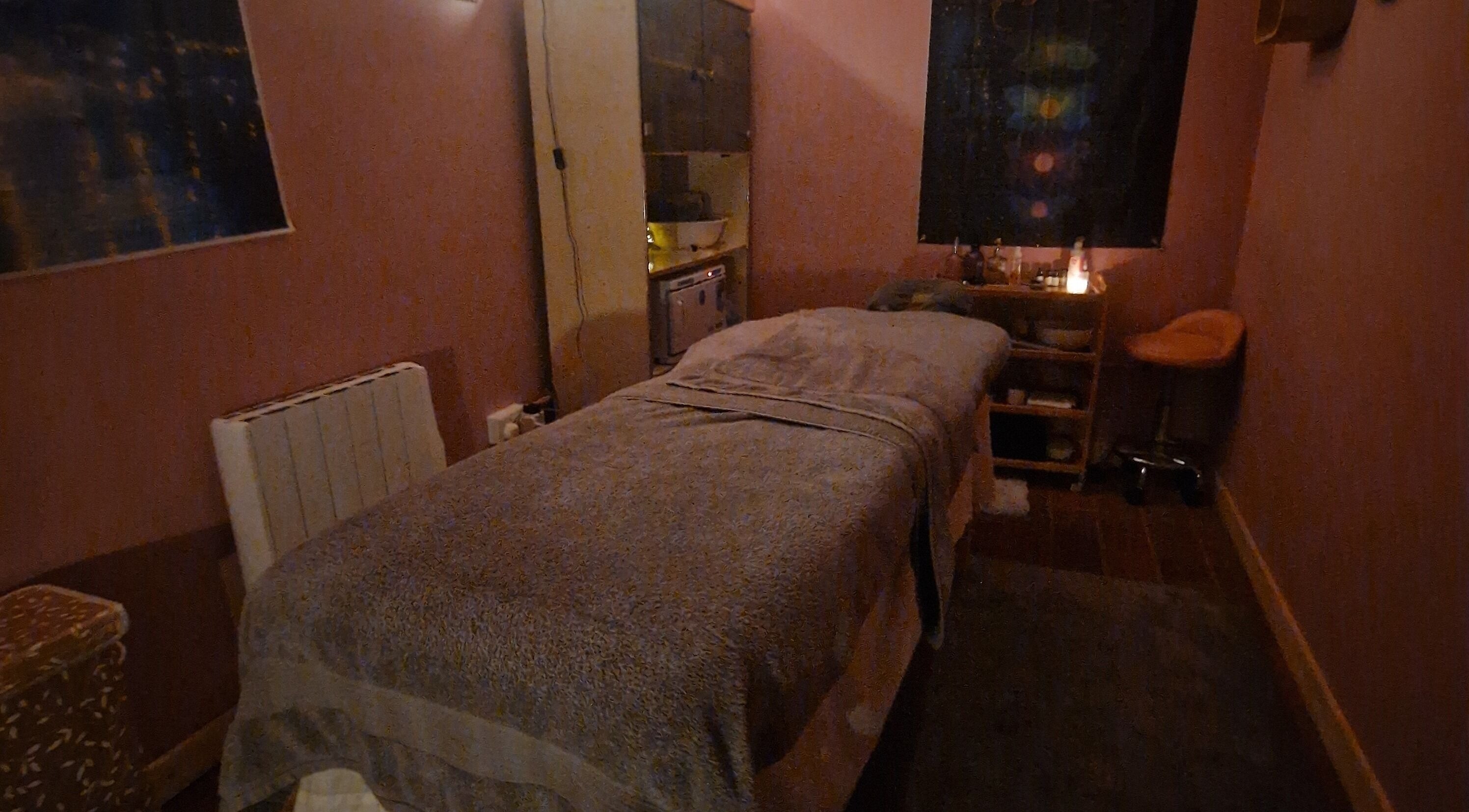 Tranquil room in The Green Witches Doneraile Well Being Hub, Doneraile, County Cork, IE, featuring a massage table.