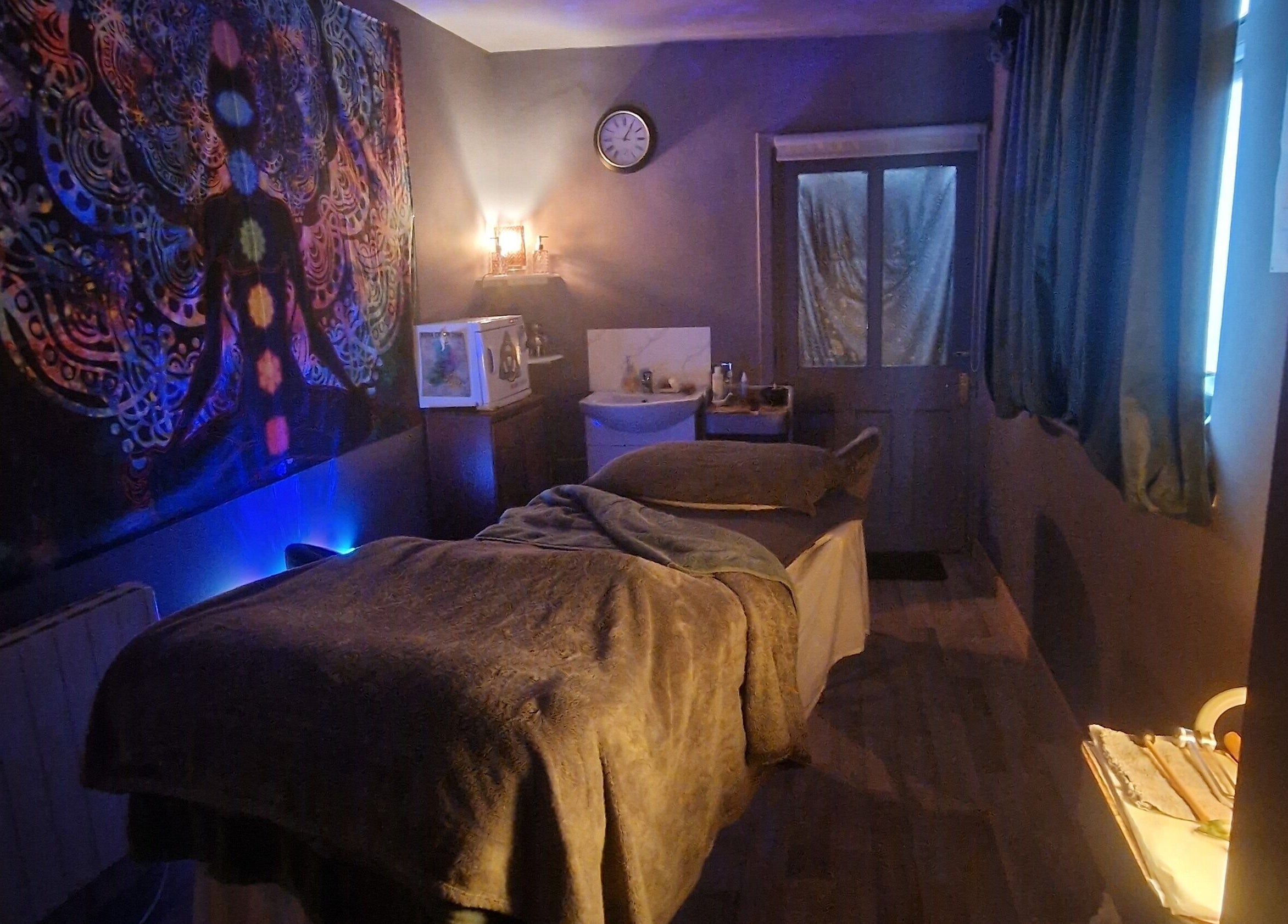 Relaxing massage room at The Green Witches Doneraile Well Being Hub, Doneraile, County Cork, IE with ambient lighting.